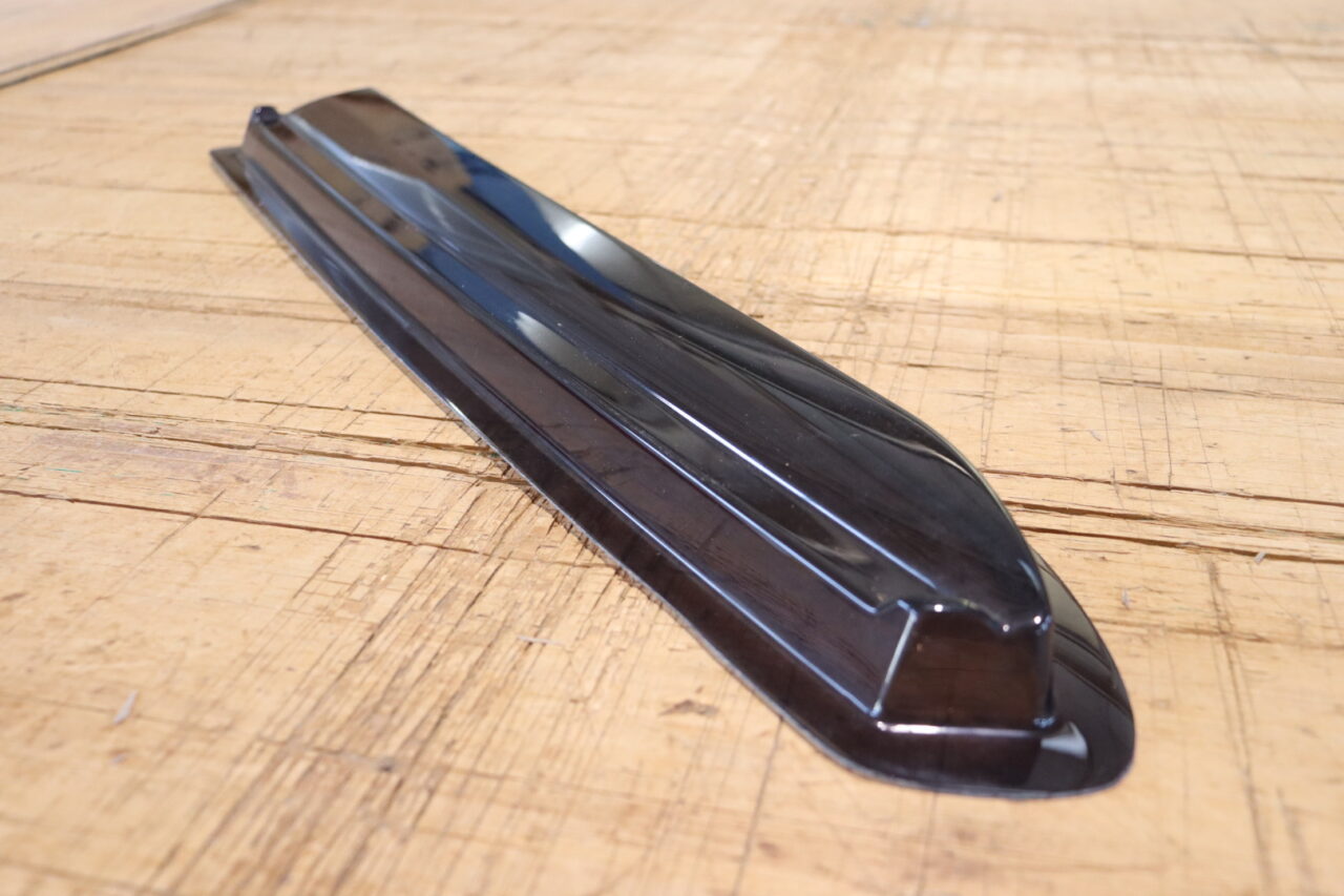 Vacuum formed product using resin mold by Suzuharu, showing reduced lead time and cost compared to metal molds.