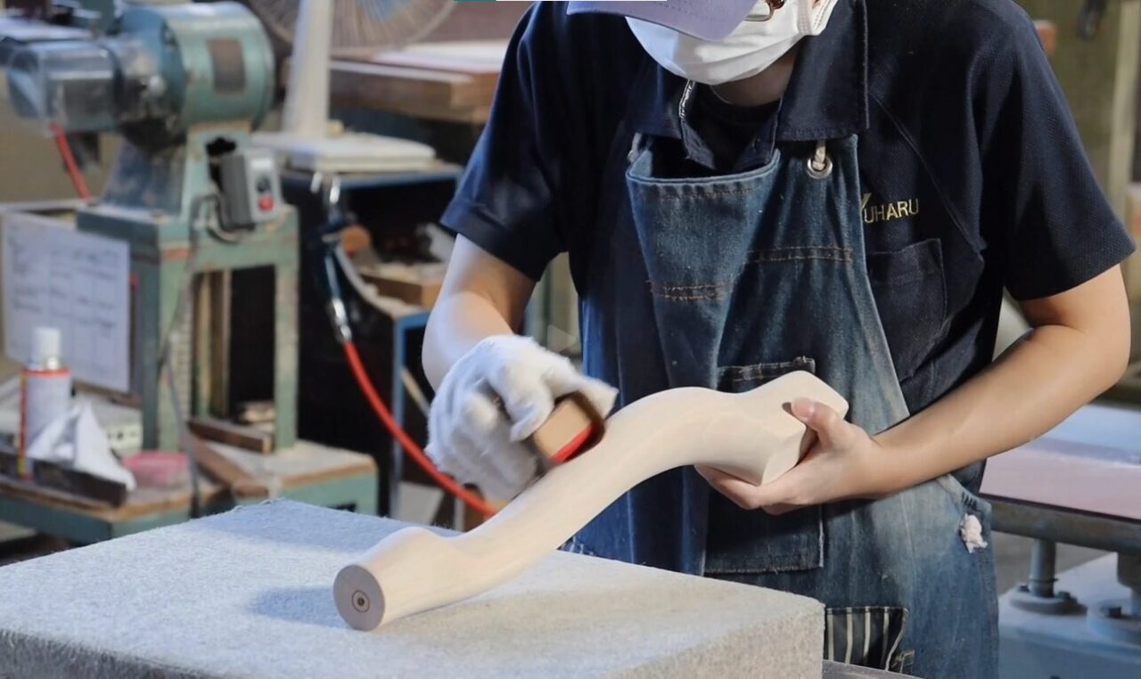 Hand finishing process for wooden components on a wood lathe.