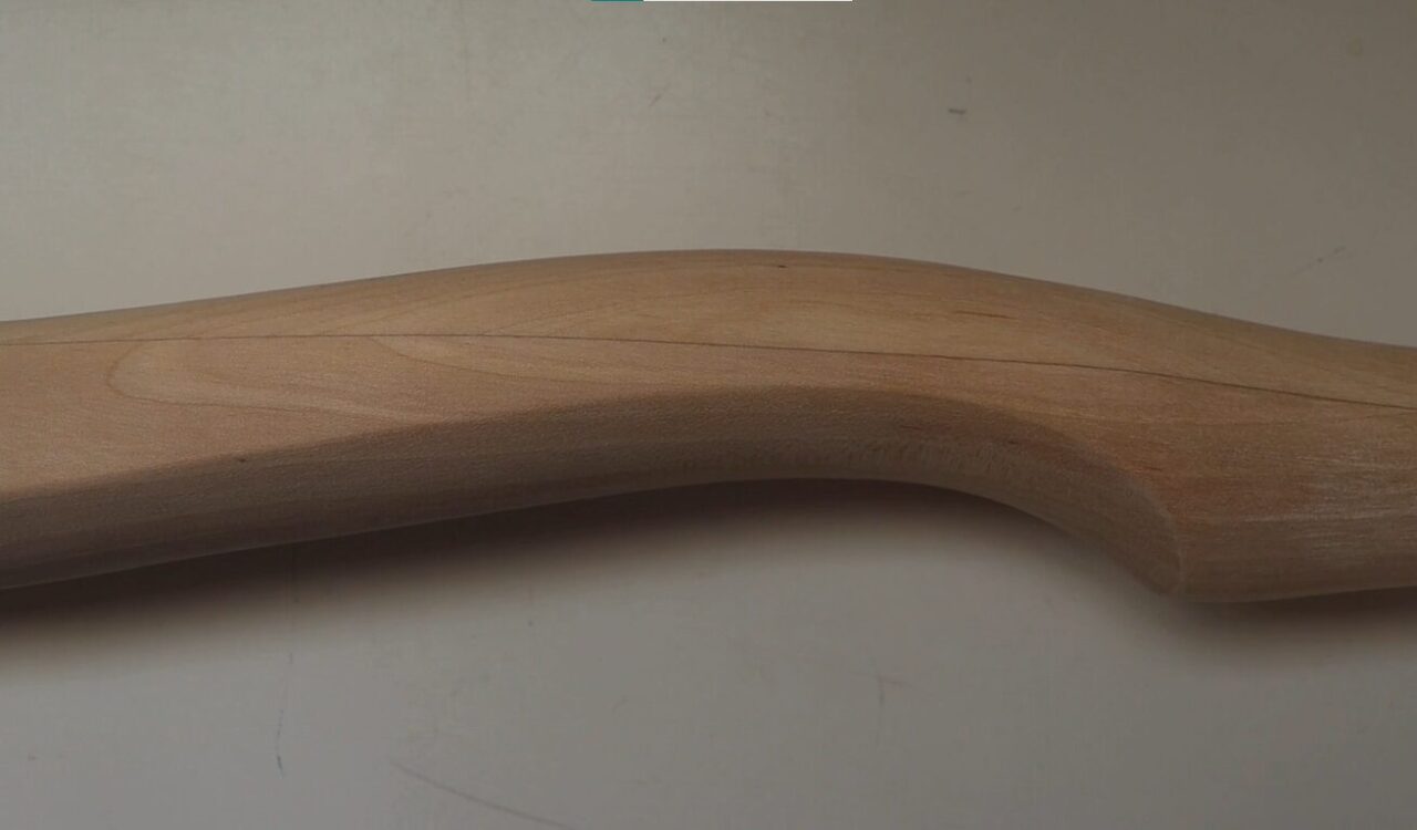 Chippendale-style furniture leg showcasing intricate curved design and detailed craftsmanship.