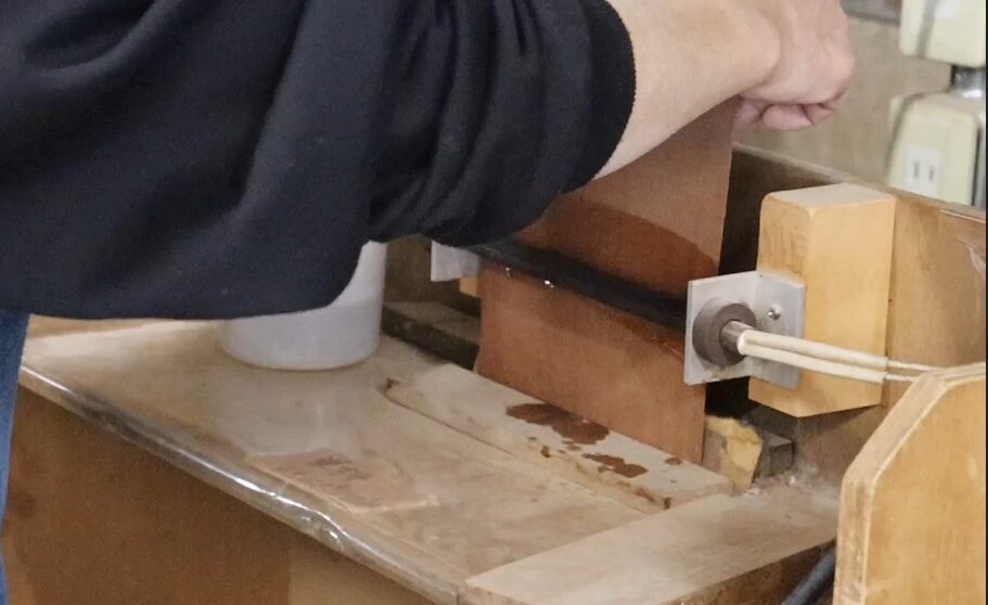 Veneer bending process: Moistening veneer sheets before bending with heat.