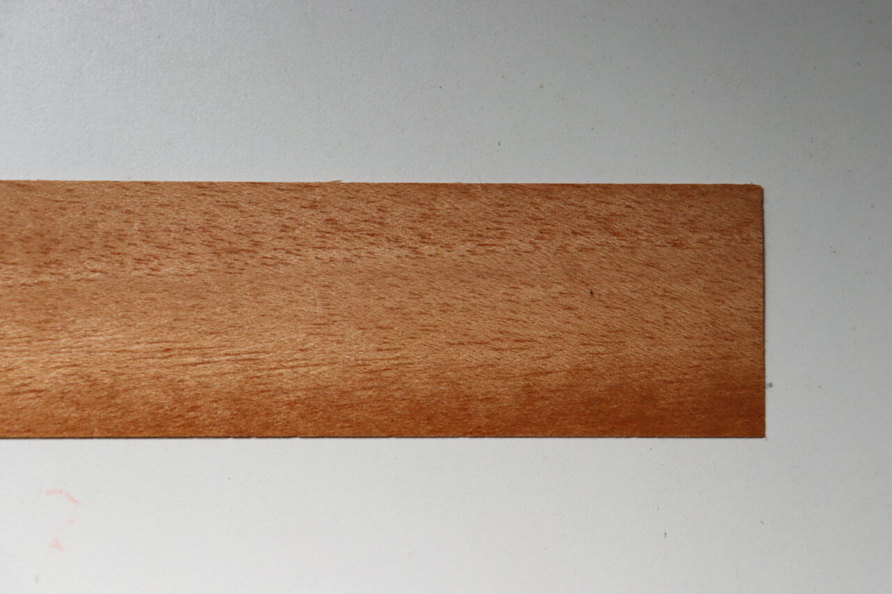 Image of Mahogany wood, known for its beautiful aging and high gloss finish. Ideal for fine furniture and musical instruments.